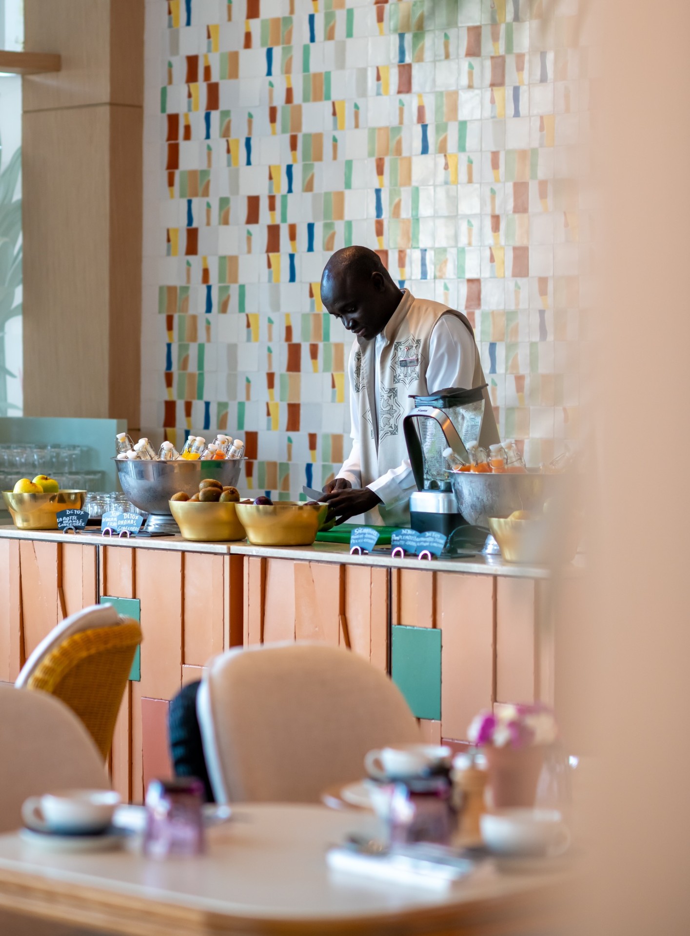 Fresh juice bar at Le V Restaurant with colourful zellige tiles